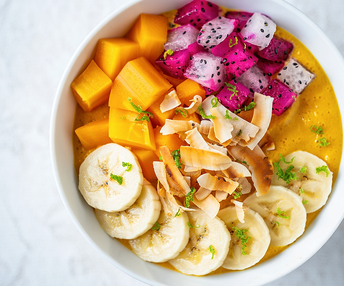 The juice bar counter lined with fresh fruit and vibrant blends
